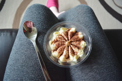 Cropped image of woman holding dessert