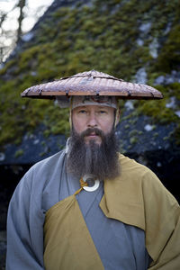 Portrait of man standing outdoors