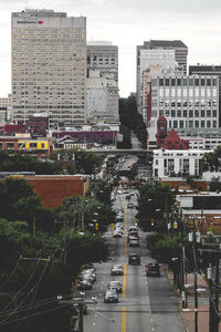 Cars on city against sky