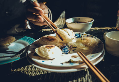 Midsection of man having food