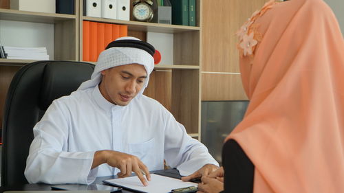 Portrait of man working at office