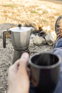 Hand holding coffee cup