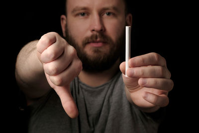Portrait of man holding camera