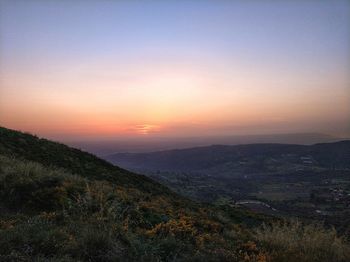 Scenic view of landscape against sky during sunset