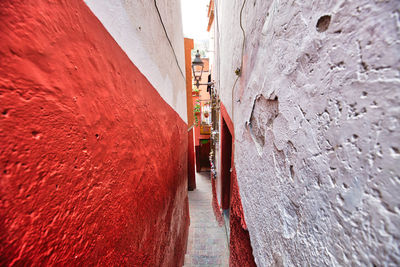 Close-up of narrow alley amidst buildings