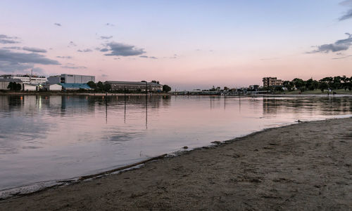 Scenic view of beach against sky during sunset