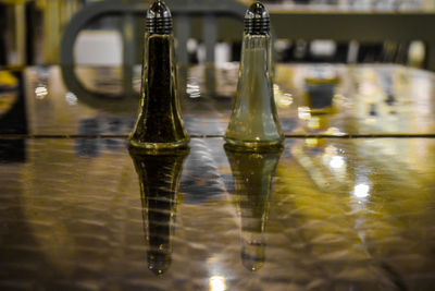 Close-up of glass bottle on table