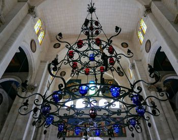 Low angle view of illuminated chandelier in building