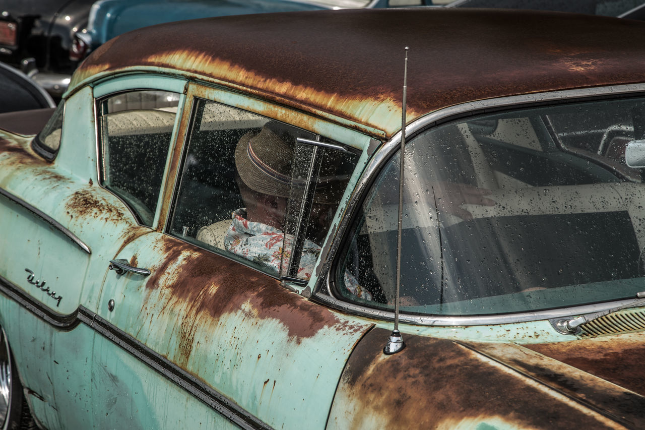 transportation, mode of transport, land vehicle, car, train - vehicle, rail transportation, railroad track, public transportation, travel, vehicle interior, train, passenger train, part of, metal, vehicle part, day, headlight, no people, abandoned, close-up