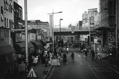 Group of people walking on city street