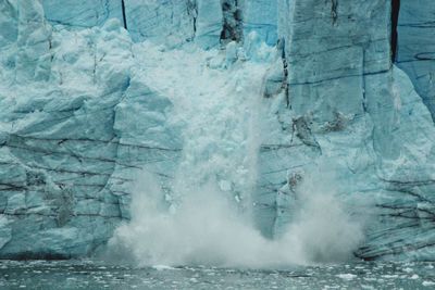 Ice breaking from a glacier