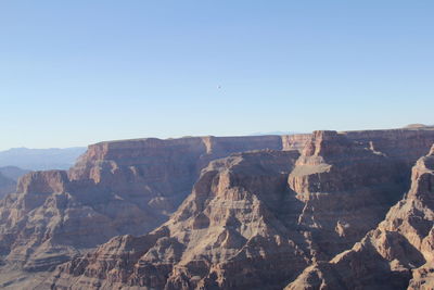 Scenic view of rocky mountains against clear sky