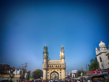 View of cathedral against blue sky in city