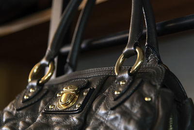 Low angle view of purse hanging on rack