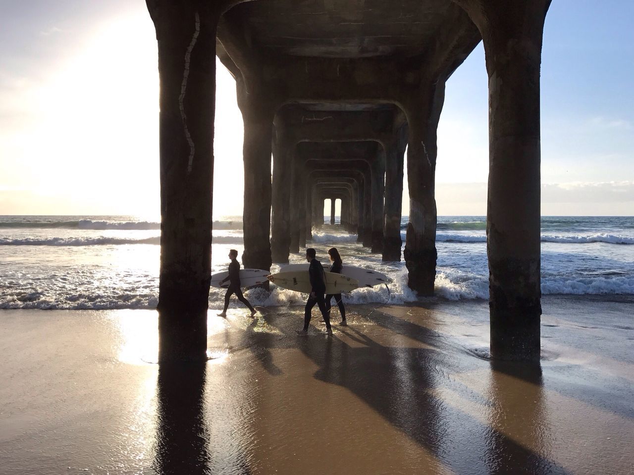 sea, built structure, water, beach, architecture, architectural column, horizon over water, day, sky, outdoors, nature, sunset, beauty in nature, scenics, below, no people, underneath