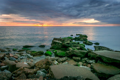 Scenic view of sea against sky at sunset