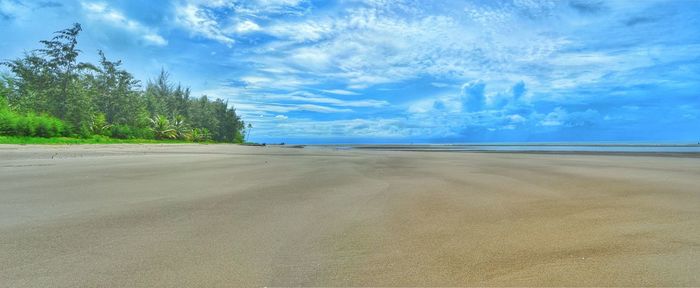 Scenic view of landscape against blue sky