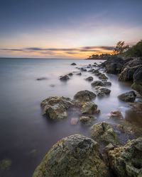 Scenic view of sea against sky during sunset