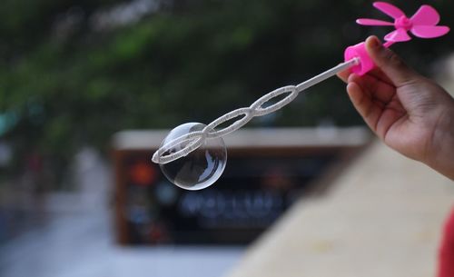 Close-up of hand holding bubbles