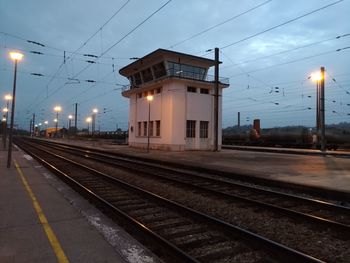 View of railroad station platform at dusk