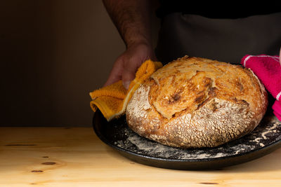 Midsection of person preparing food on table