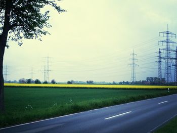 Electricity pylons on field