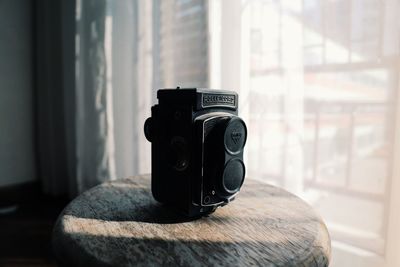 Close-up of camera on table