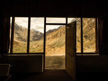 Mountains seen through open door