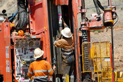 Rear view of man working at construction site