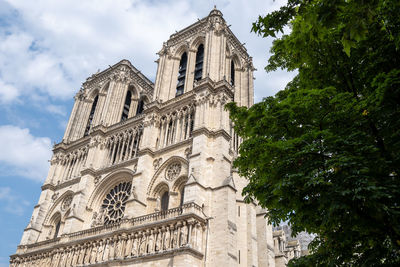 Famous notre dame cathedral paris view of the main facade. famous catholic cathedral in paris