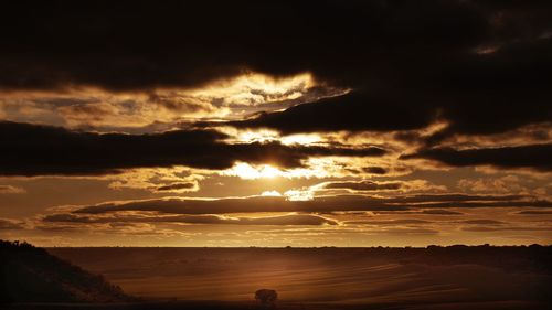 Scenic view of dramatic sky during sunset