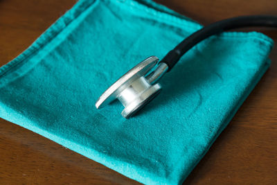 High angle view of stethoscope on table