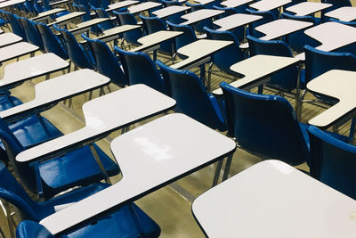 High angle view of empty chairs on table