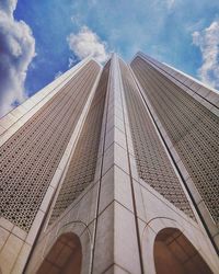 Low angle view of building against cloudy sky