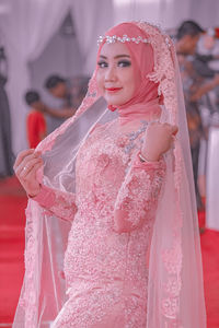 Portrait of bride standing in wedding ceremony