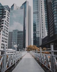 Street amidst buildings in city against sky