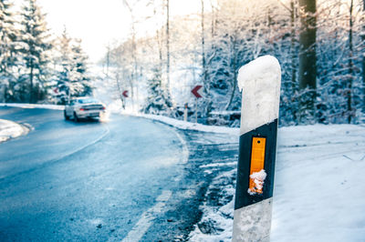 Close-up of road sign on snow