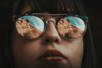 Close-up of young woman wearing sunglasses