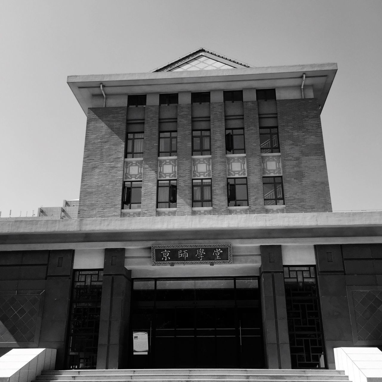 building exterior, architecture, built structure, low angle view, window, building, clear sky, city, residential building, modern, office building, sky, residential structure, glass - material, day, balcony, exterior, outdoors, no people, sunlight