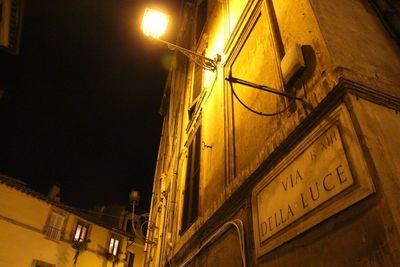 Low angle view of illuminated building at night