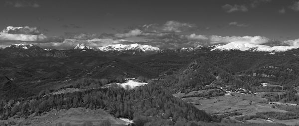 Scenic view of mountains against sky during winter