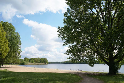 Bathing lake with empty beach in spring - altwarmbuchener see near hannover in germany