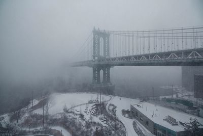 View of suspension bridge in foggy weather