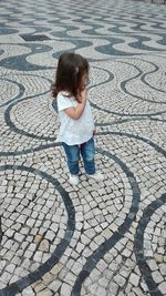 Full length of boy on paving stone