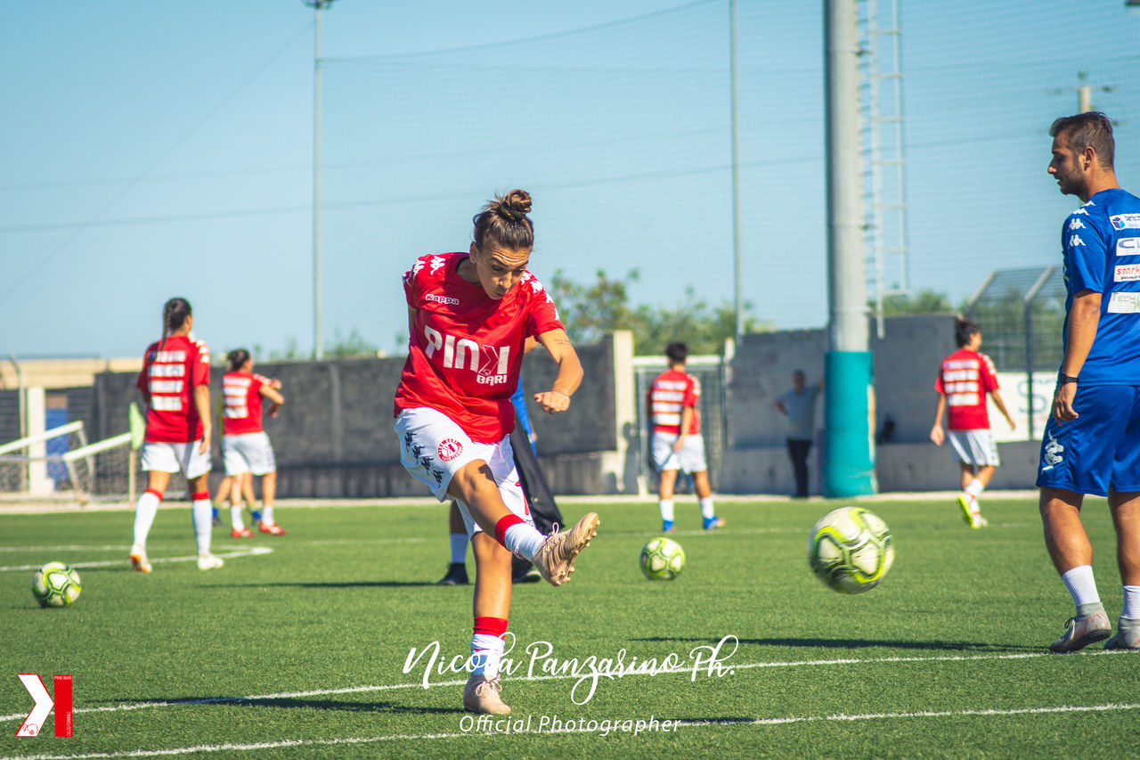 GROUP OF PEOPLE PLAYING SOCCER