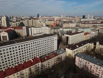 High angle view of buildings in city against sky