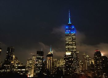 View of skyscrapers lit up at night