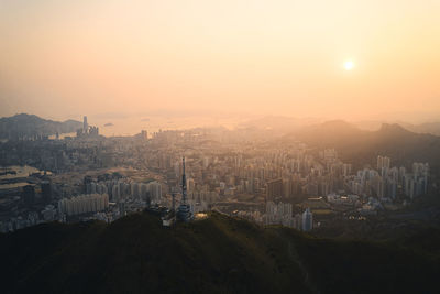 High angle view of buildings against sky during sunset