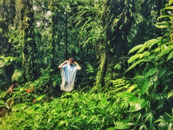 Man standing in forest