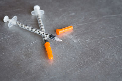 Surface level of syringes on table